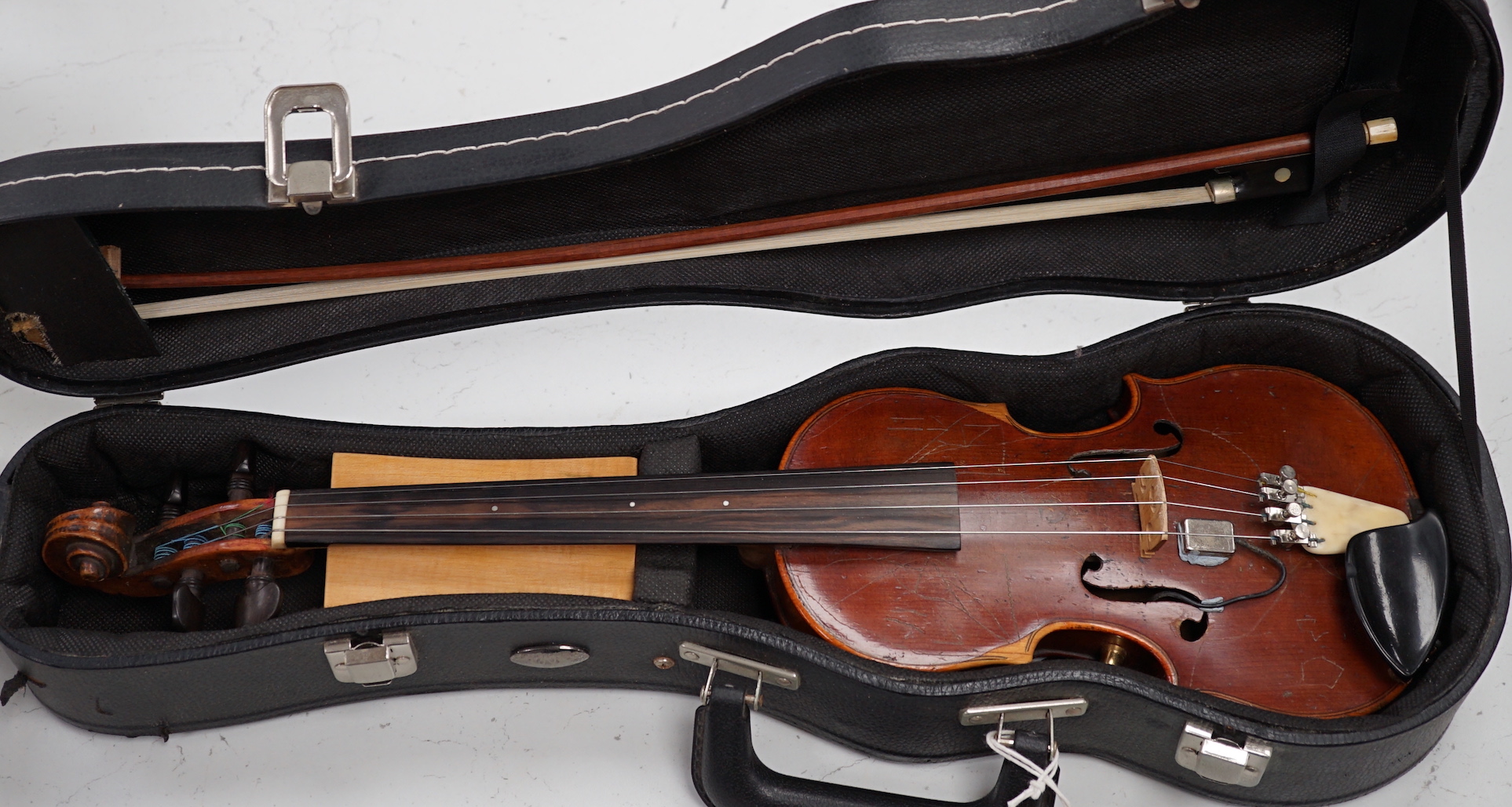 An unusual travelling violin (Pochette), length of body, 25.5cm, with standard length neck, with shorter 53.5cm bow and fitted case, overall length of violin 55cm